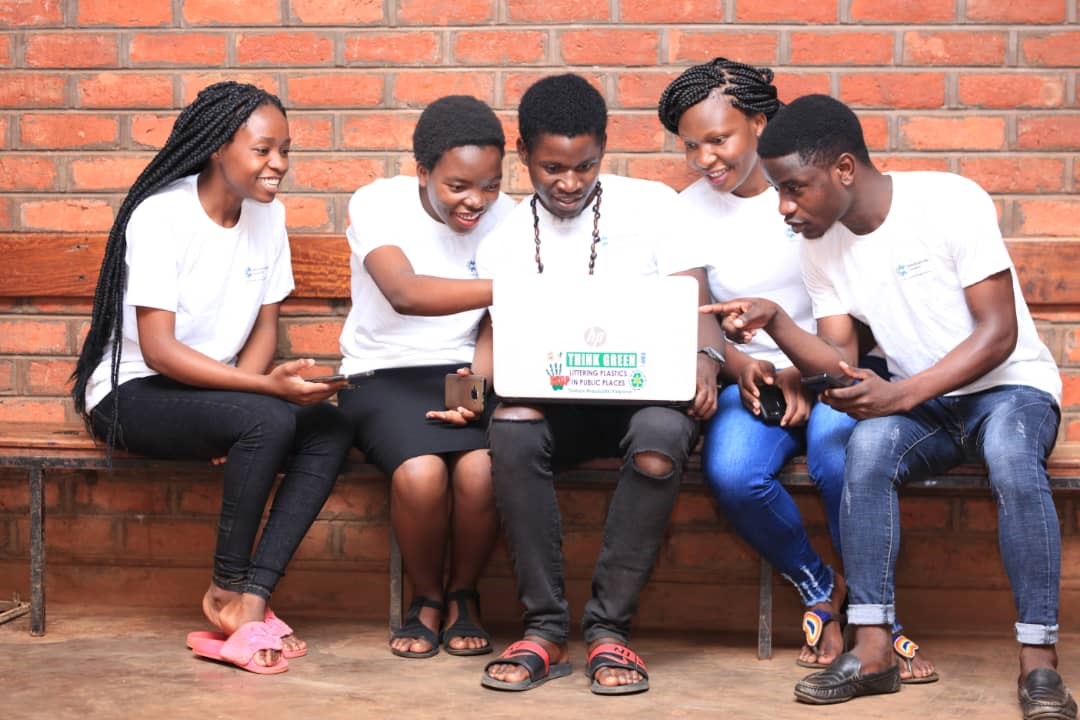 University students look at a map of the location of dumpsites around their campus